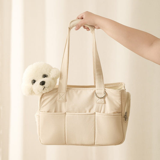 Beige tote bag with a white teddy bear peeking out on a beige background