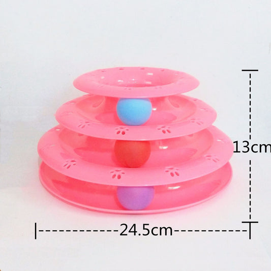 Pink three-tiered pet toy with colorful balls on a white background
