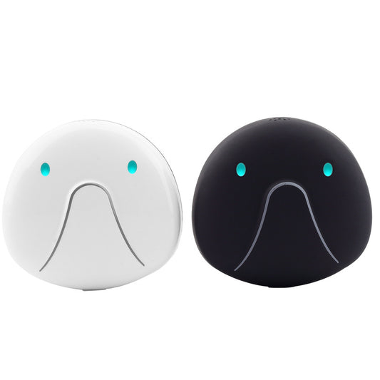 Two round devices, one white and one black, with facial features on a white background.