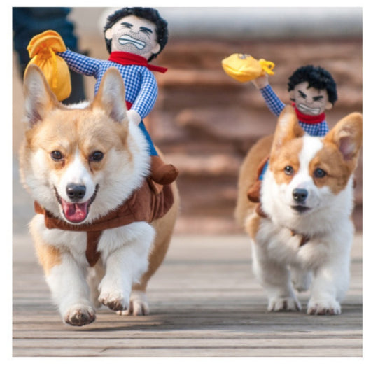 Two corgis running on a wooden surface with toy figures of people in the background.