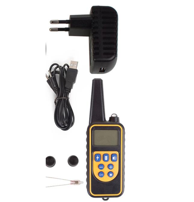 Dog training collar with charger, cable, and earbuds on a white background