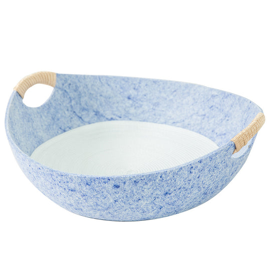 Blue speckled bowl with beige handles on a white background