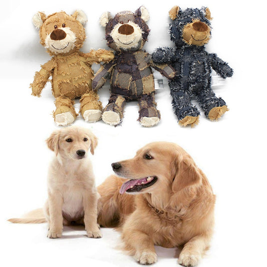 Three plush dog toys resembling bears and a dog sitting next to them on a white background