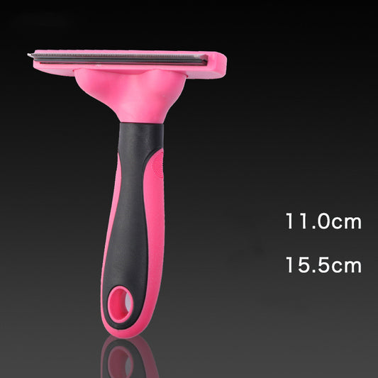 Pink and black pet grooming brush with measurements on a dark background