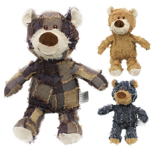Three plush toys resembling wolves and a bear on a white background