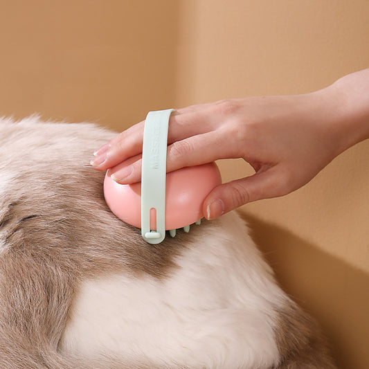 Person using a pet grooming tool on a dog's fur with a plain background