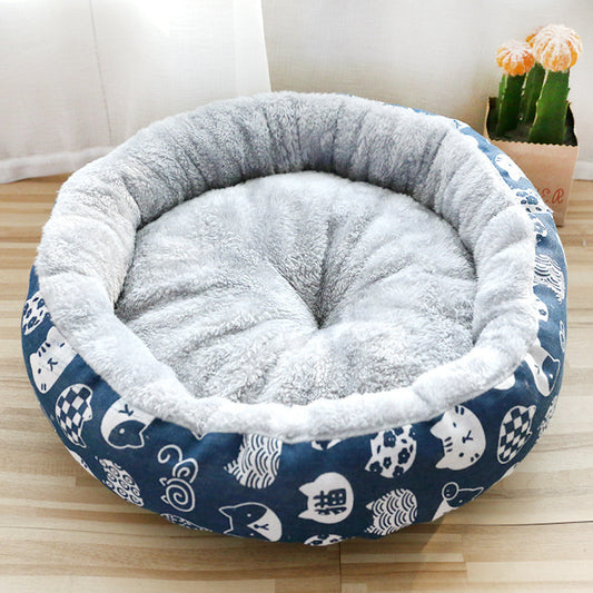 Pet bed with cat pattern on a wooden floor