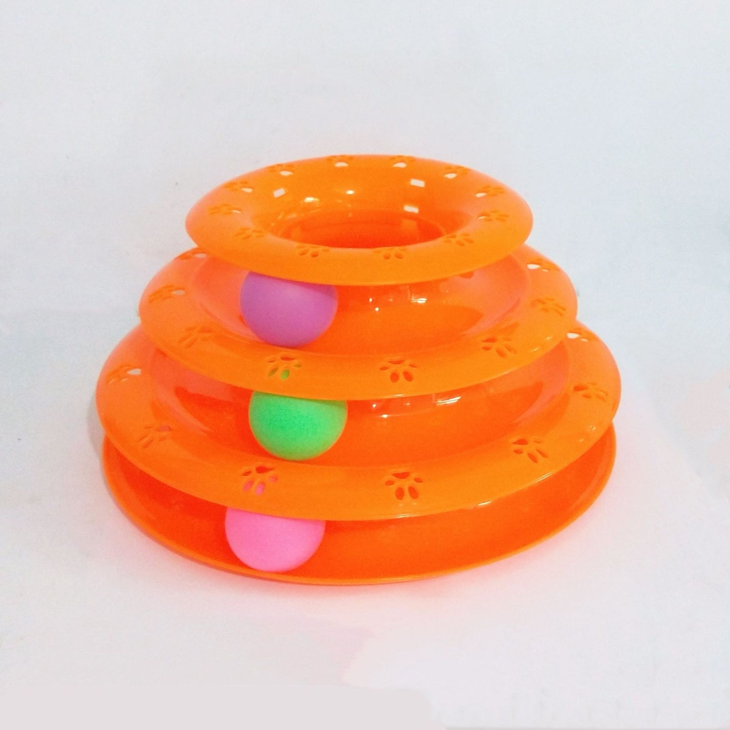 Orange three-tiered pet toy with pink and green balls on a white background