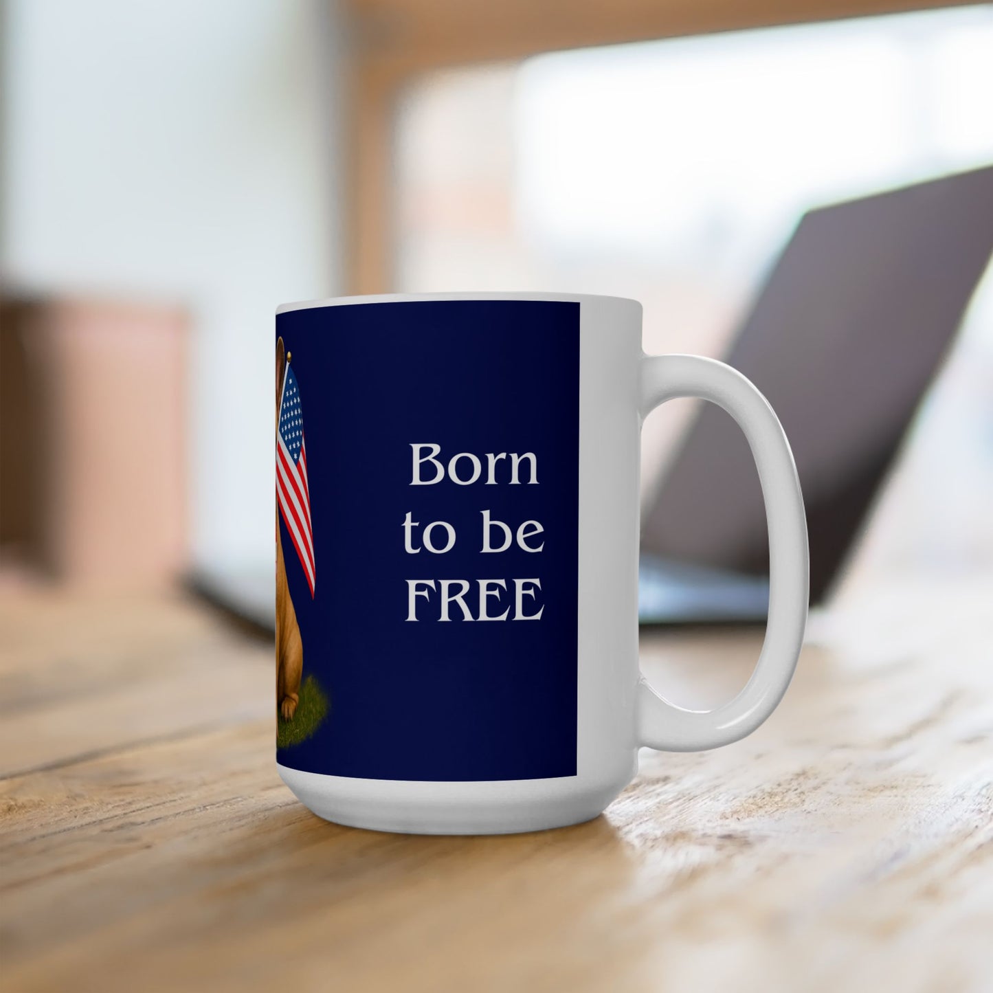 Mug with 'Born to be FREE' text on a wooden surface