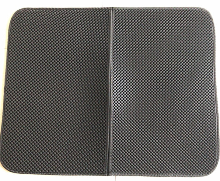 Black mesh pad with a white border on a white background
