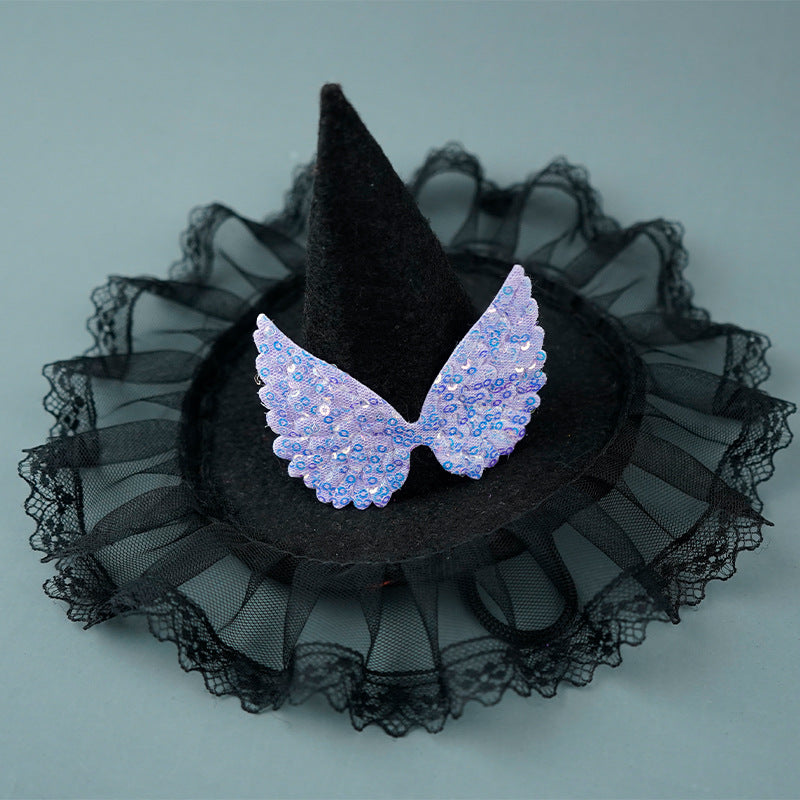 Black witch hat with sheer black lace and sparkling silver wings on a light blue background