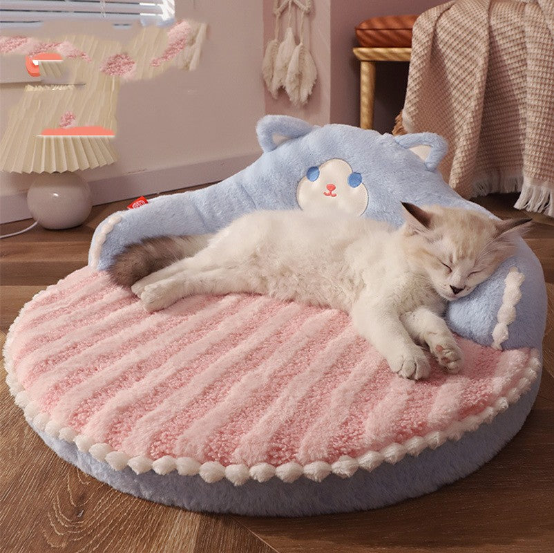 Cat sleeping on a fluffy pink and blue cat bed in a cozy room.