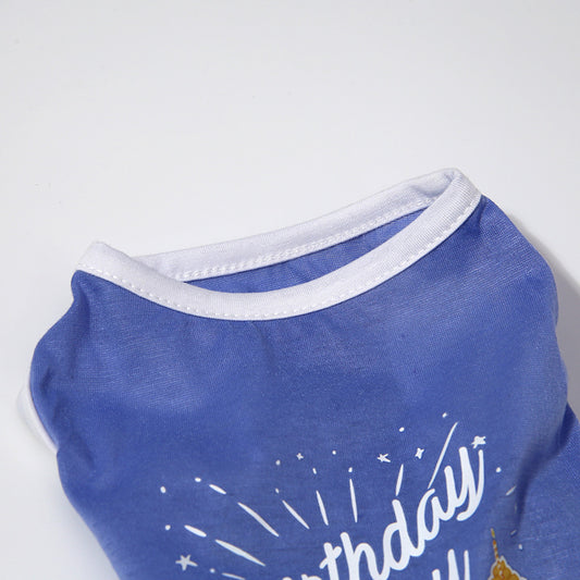 Blue pet shirt with white trim and 'Birthday' text on a light gray background