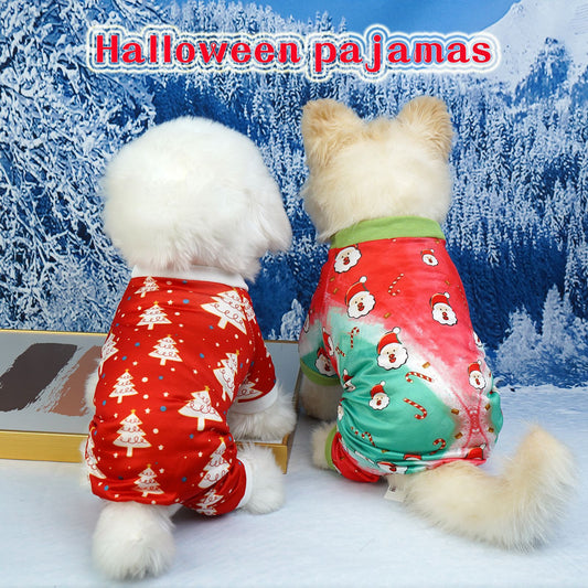 Two dogs wearing red and green Christmas-themed pajamas in front of a snowy landscape.