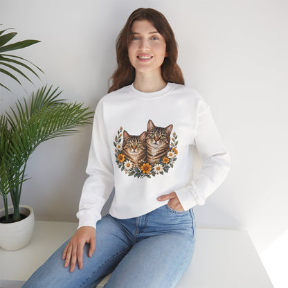 Two tabby cats and wildflowers printed on a black unisex crewneck sweatshirt