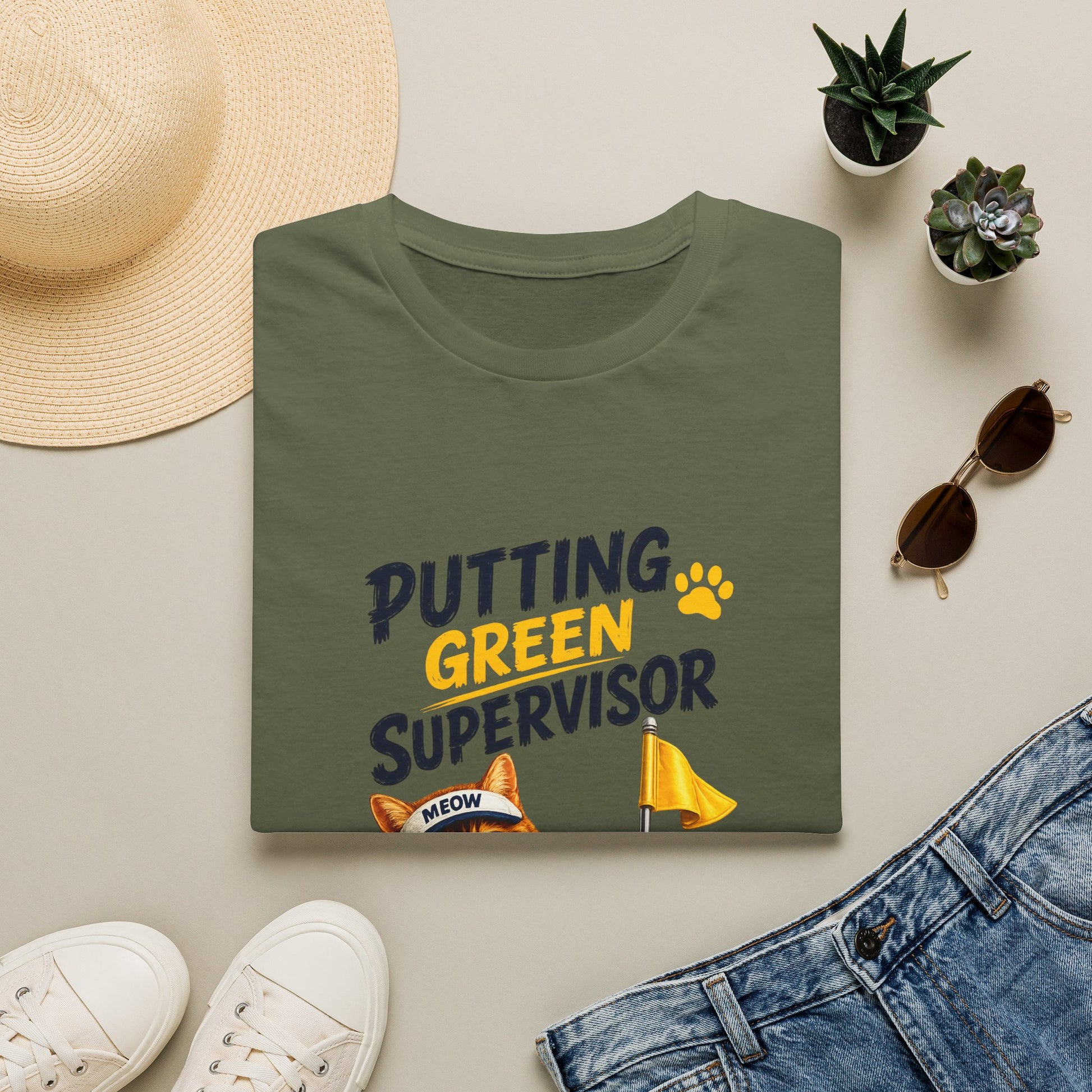 Putting Green Supervisor funny cat golf T-shirt with orange tabby beside golf hole- military green