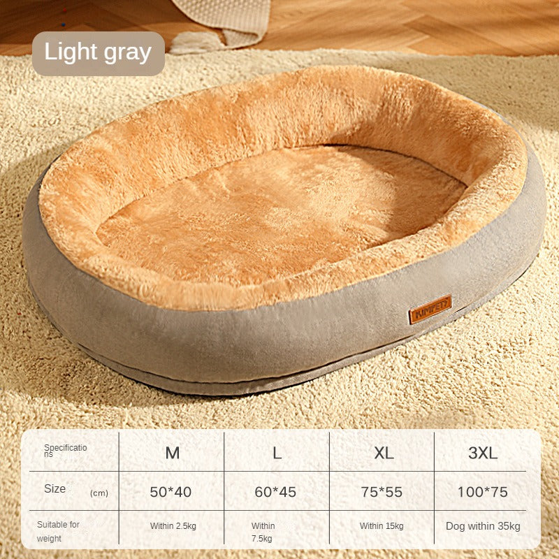 Round pet bed with light gray exterior and beige interior on a carpeted floor.