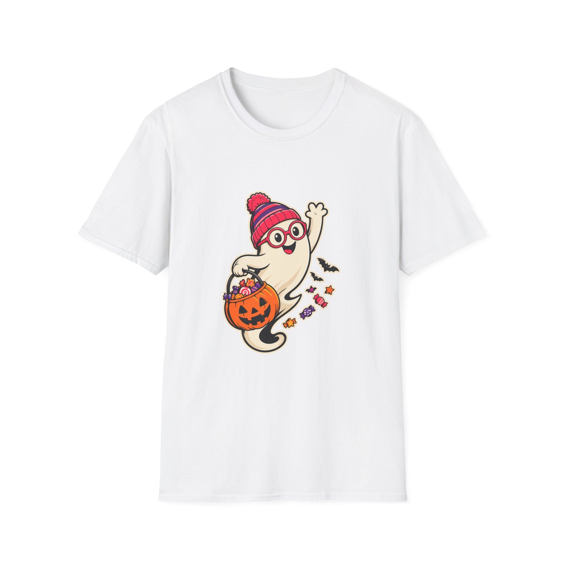 A white short-sleeve crewneck t-shirt featuring a cartoon graphic of a cute ghost wearing a red and pink striped beanie and glasses, holding an orange jack-o'-lantern bucket filled with treats.