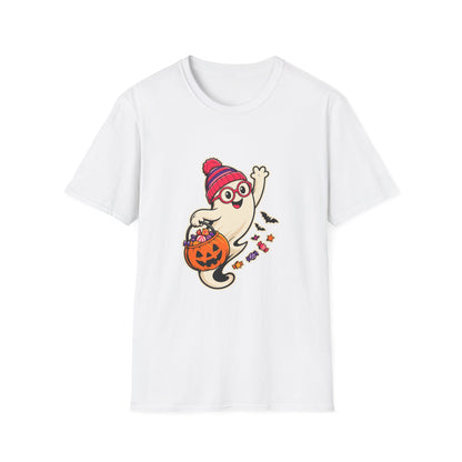 A white short-sleeve crewneck t-shirt featuring a cartoon graphic of a cute ghost wearing a red and pink striped beanie and glasses, holding an orange jack-o'-lantern bucket filled with treats.