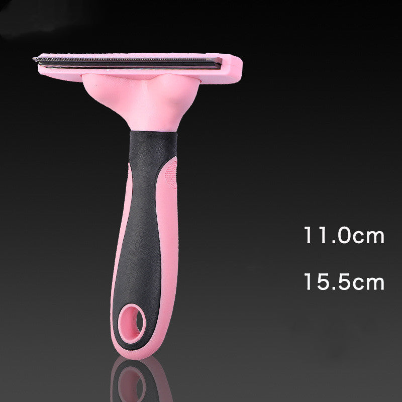 Pink and black pet grooming brush on a dark background with measurements indicated.