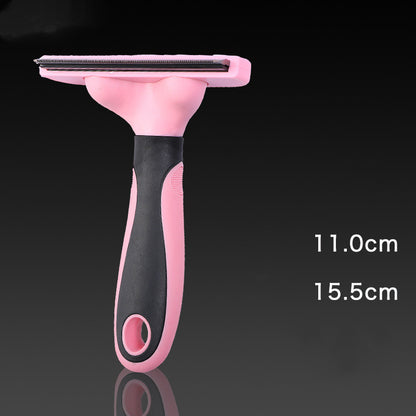 Pink and black pet grooming brush on a dark background with measurements indicated.
