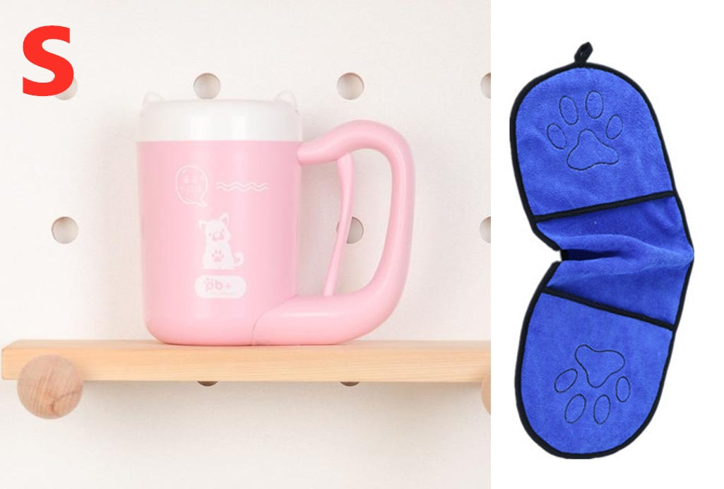 Pink mug on a wooden shelf with a blue paw print oven mitt next to it.