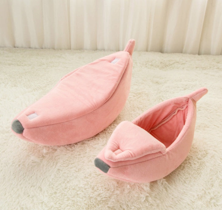 Two pink pet beds on a beige carpet