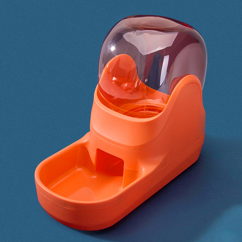 Orange pet feeder with transparent top on a blue background