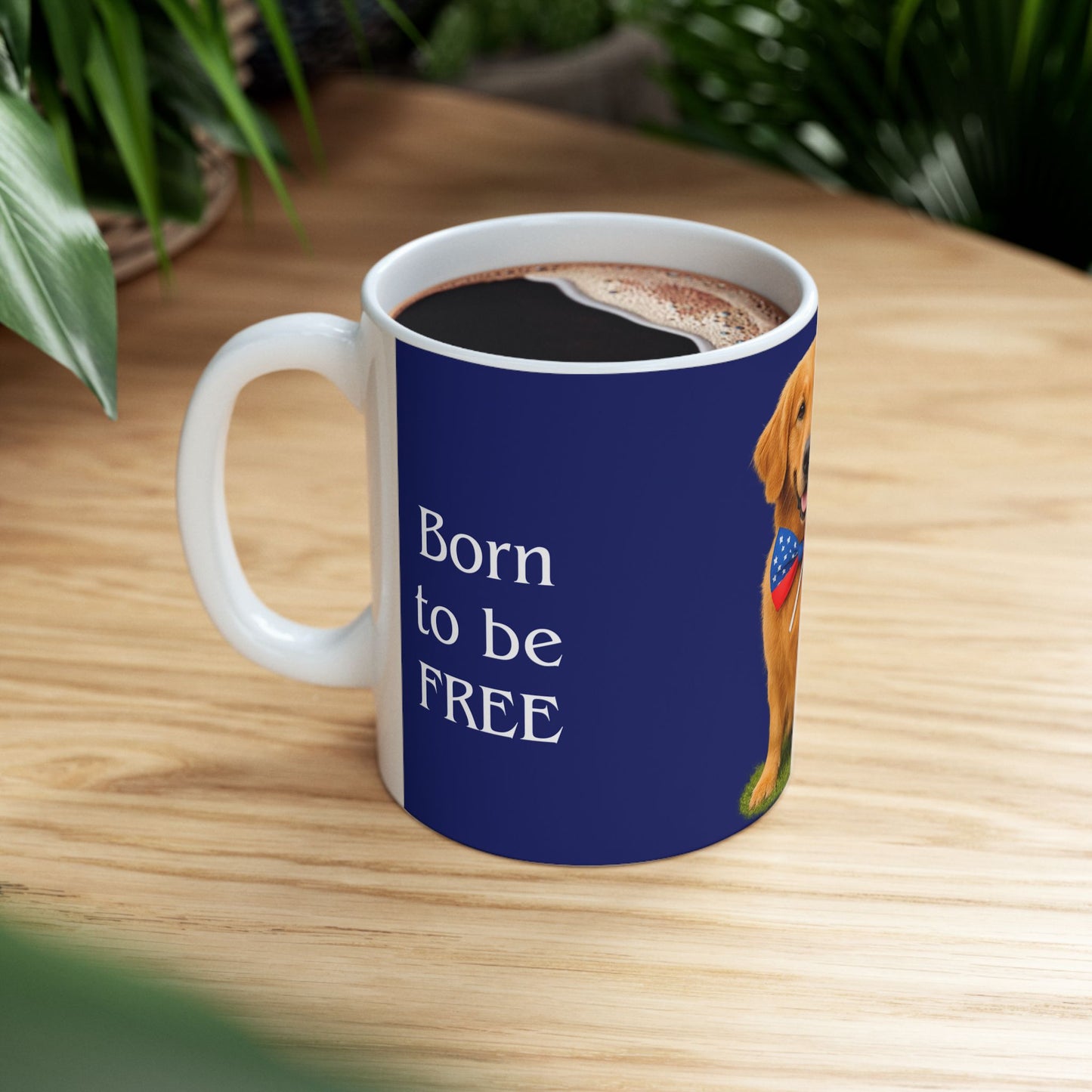 Mug with a dog illustration and 'Born to be FREE' text on a wooden table.