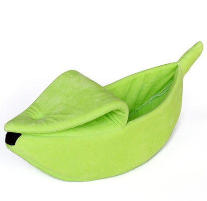Green bean-shaped pet bed on a white background