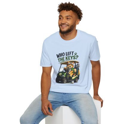 A light blue short-sleeve crewneck t-shirt featuring a cartoon graphic of a cat driving a green golf cart with the text 'WHO LEFT THE KEYS?' printed on the chest.