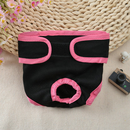 Black and pink pet diaper on a textured surface with a woven basket in the background