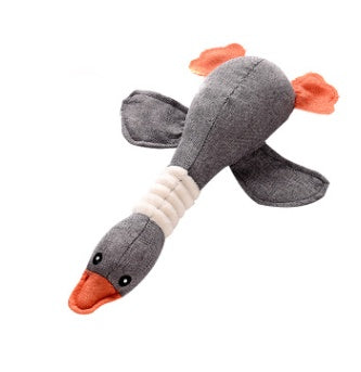 Gray plush toy resembling a bird with orange beak and feet on a white background