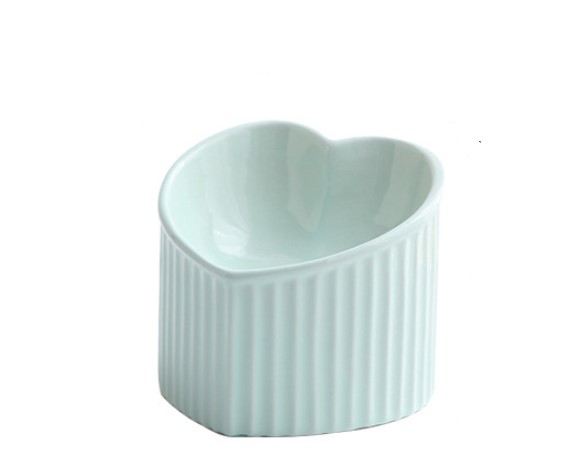 Heart-shaped ceramic bowl with ribbed texture on a white background