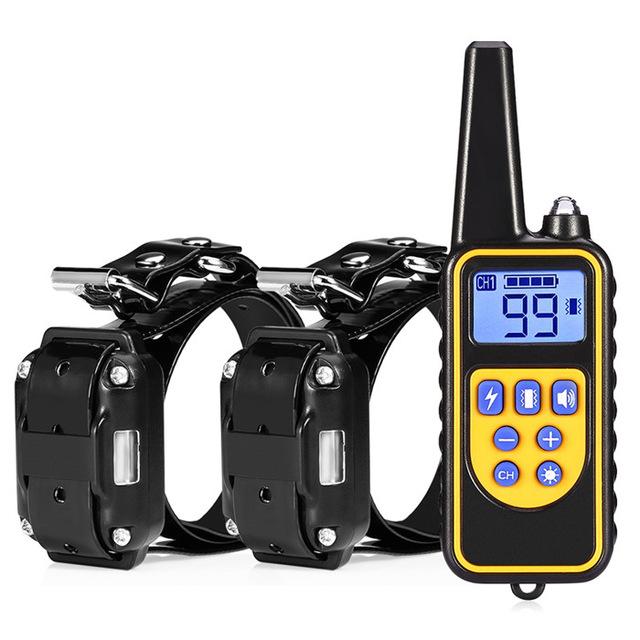 Two dog collars with a remote control on a white background