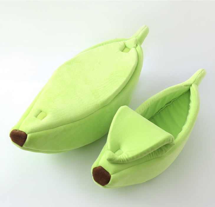 Green banana-shaped pet beds on a white background