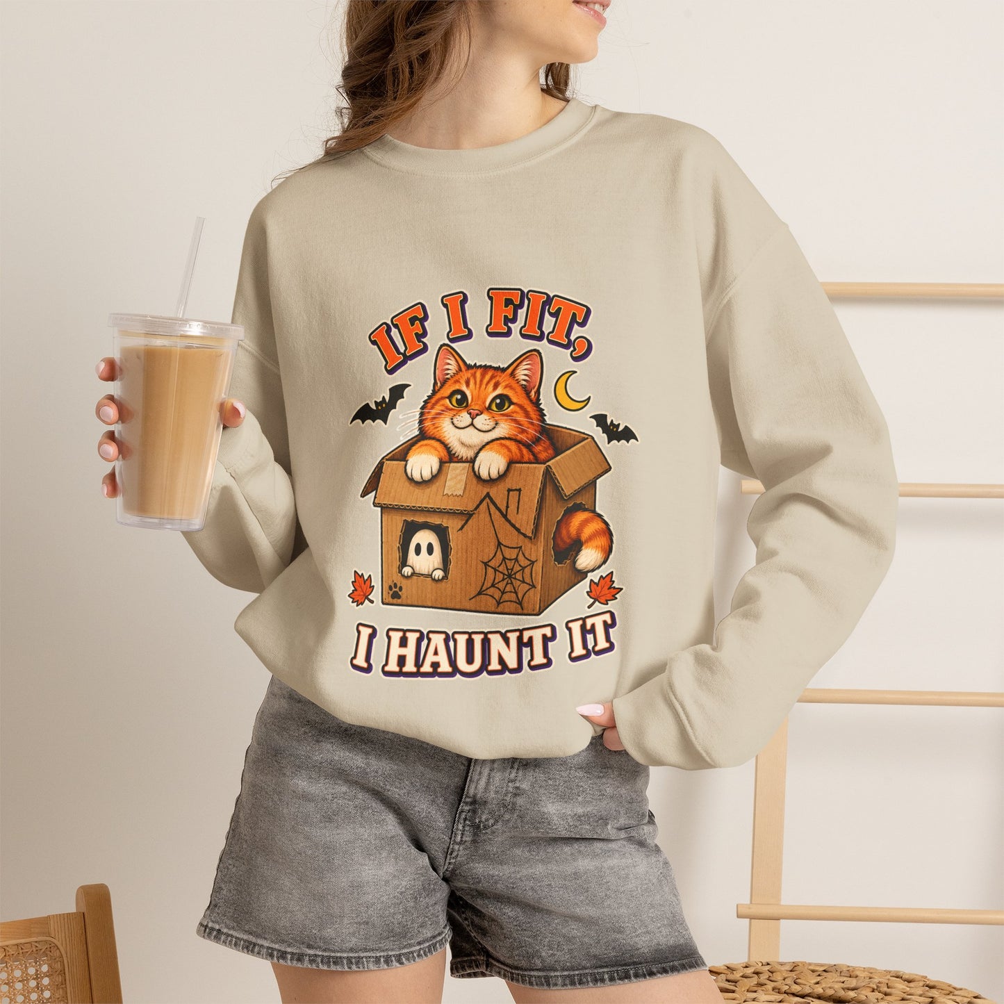 If I Fit I Haunt It Halloween cat sweatshirt in sand
Orange tabby in haunted cardboard box on Halloween sweatshirt