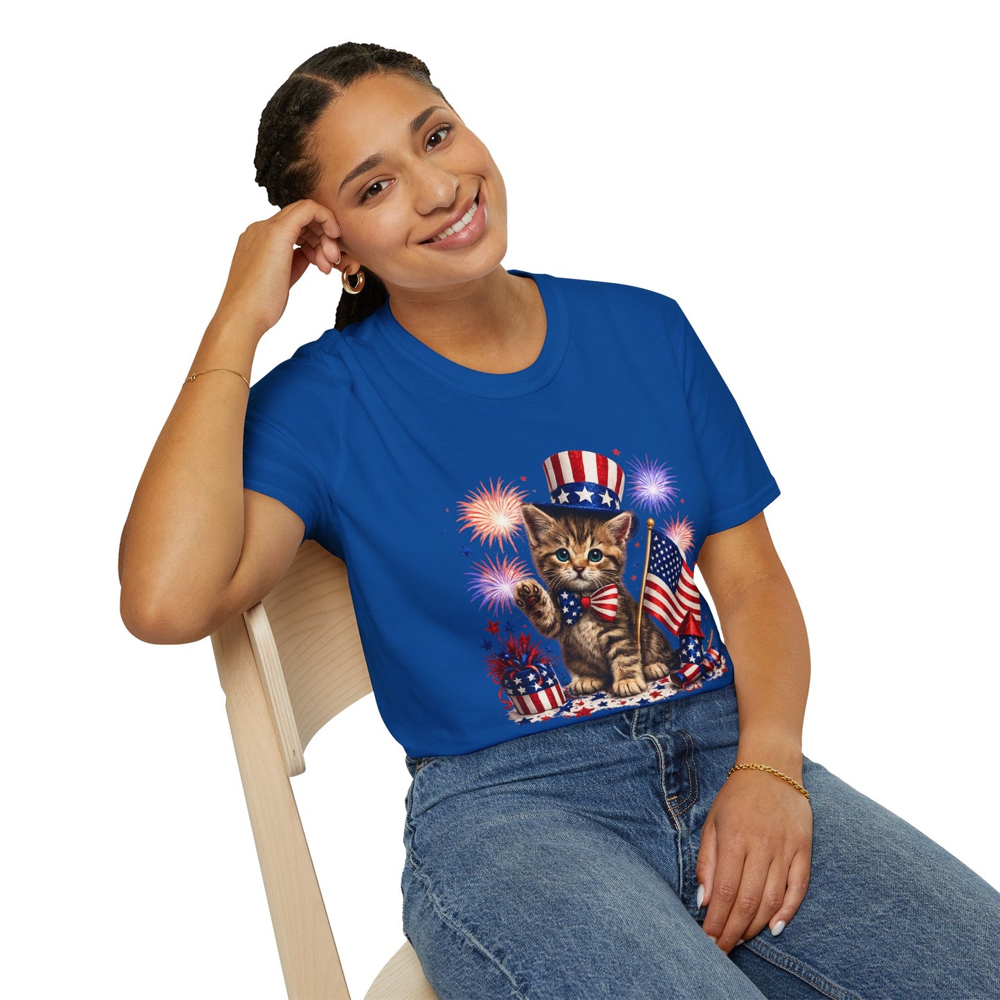 Woman wearing a blue t-shirt with a cat graphic featuring American flags and fireworks.