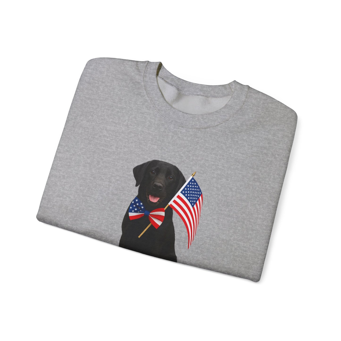 Folded graysweatshirt with a black labrador wearing a USA flag bow tie on a white background