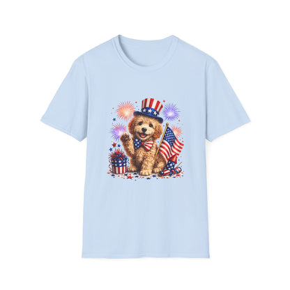 Light blue t-shirt with a dog wearing an American flag hat and holding a flag, surrounded by fireworks on a white background.
