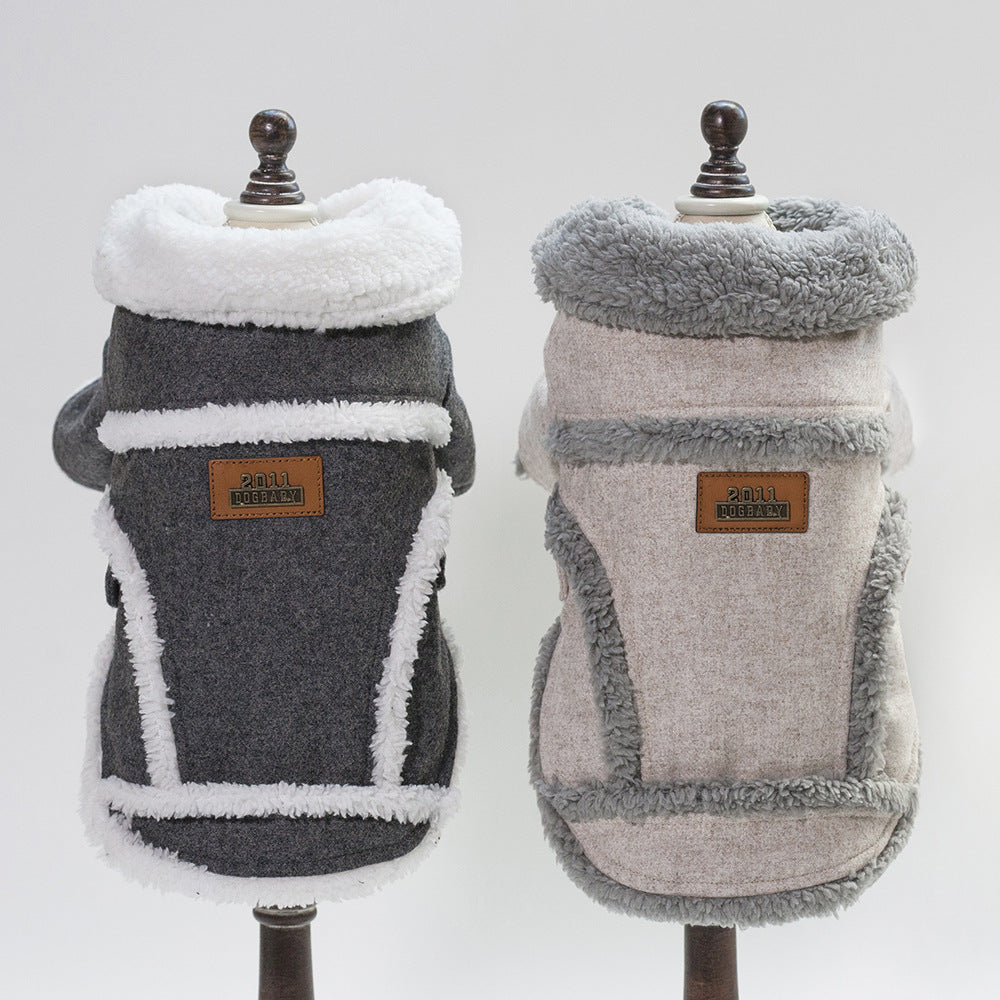 Two dog coats on mannequins with a visible brand label against a white background