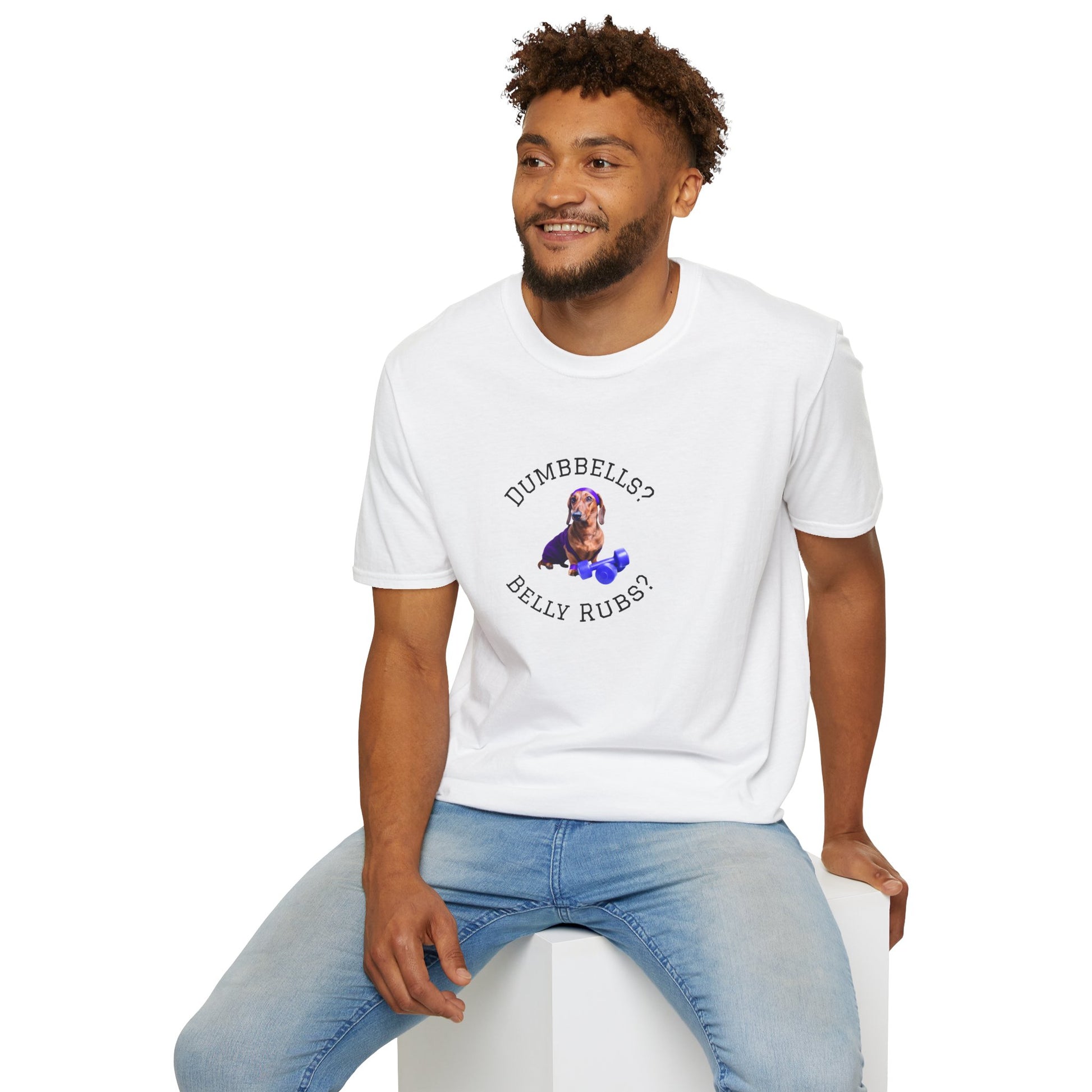 Man wearing a white t-shirt with 'HE IS RISEN' text, sitting on a white stool against a white background.