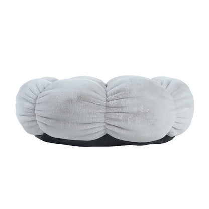 Gray plush cushion with a black base on a white background