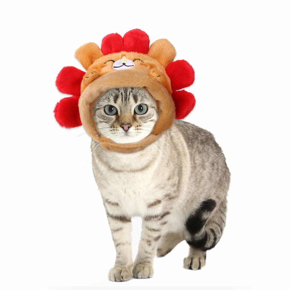 Cat wearing a lion costume with a red mane on a white background