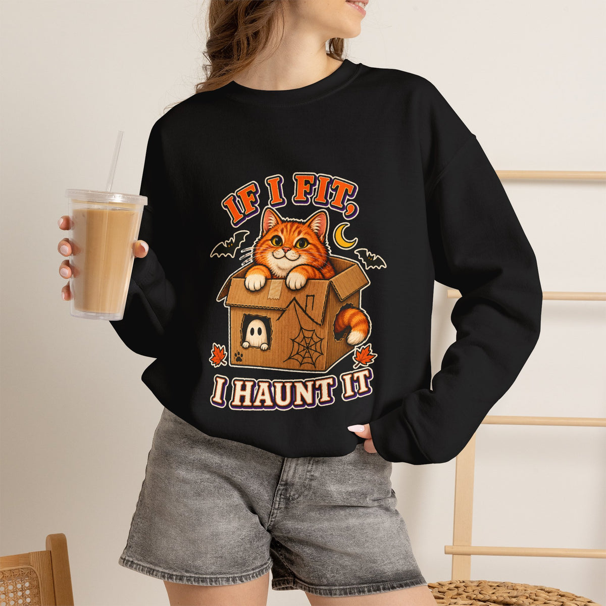 If I Fit I Haunt It Halloween cat sweatshirt in black
Orange tabby in haunted cardboard box on Halloween sweatshirt