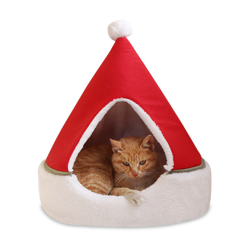 Cat inside a red and white cone-shaped pet bed on a white background