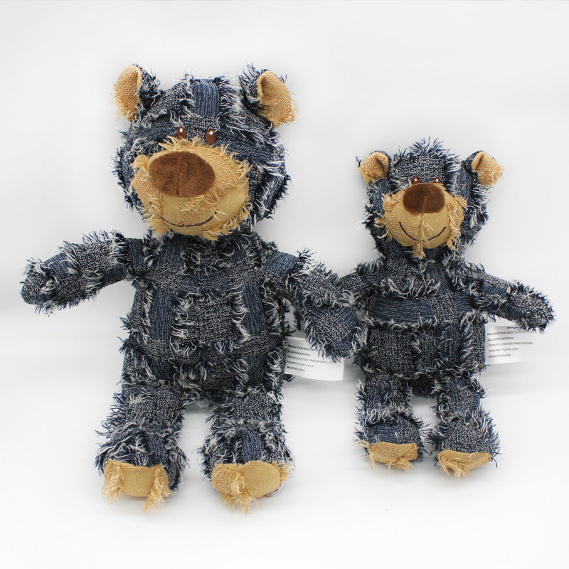 Two denim teddy bears with brown faces and paws on a white background