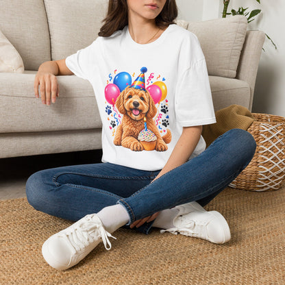 Woman sitting on floor wearing a White Birthday Dog T-Shirt featuring party puppy balloons and cupcake
