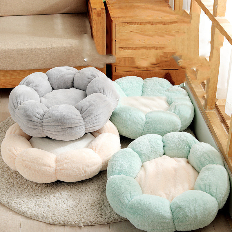 Round, plush pet beds in various colors on a carpeted floor.