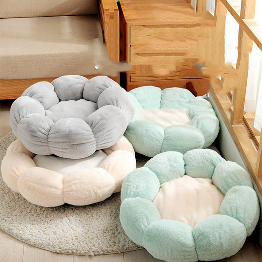 Round, plush pet beds in various colors on a carpeted floor.